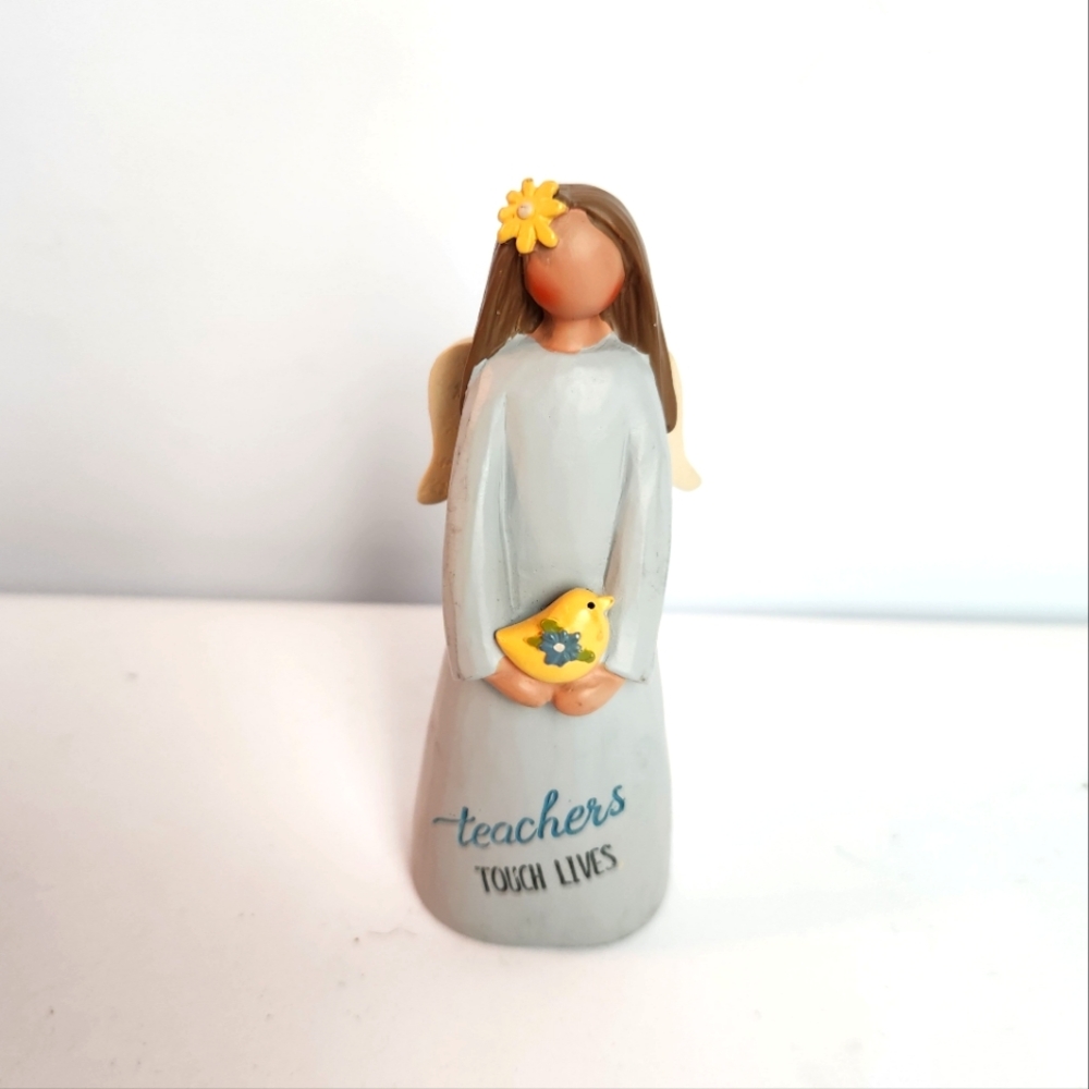 Teacher Angel holding a small bird  by Blossom